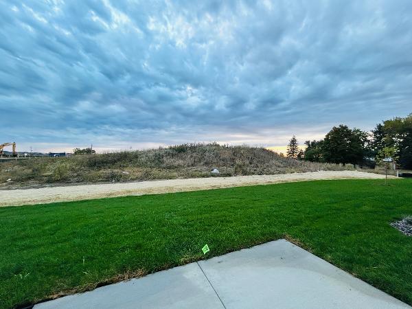 Open fields with scenic sunset next to the house