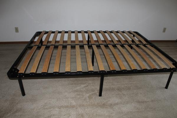A brand new wooden bed cot