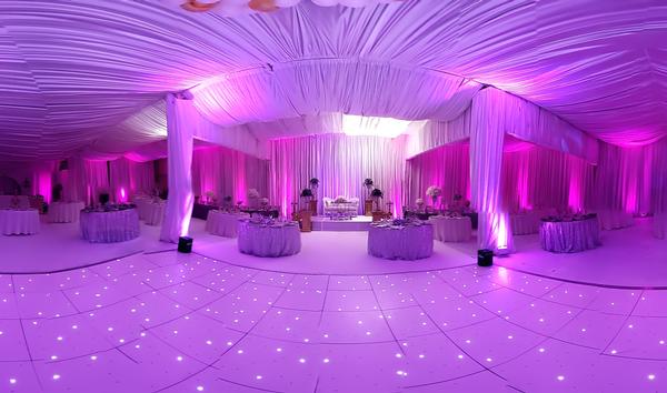 Up-lights and white lighted dancefloor